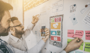 Men writing on whiteboard