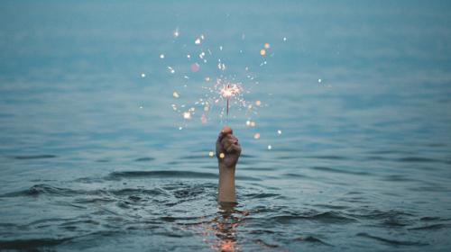 Hand holding sparkler