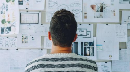 Man staring at whiteboard
