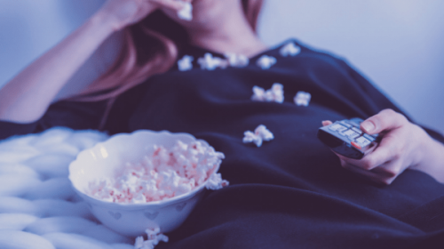 Woman eating popcorn